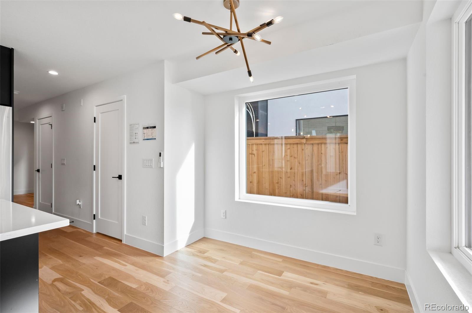 2451 Lawrence Street Denver, CO 80205 - Photo 9 of 48 a view of an empty room with a window