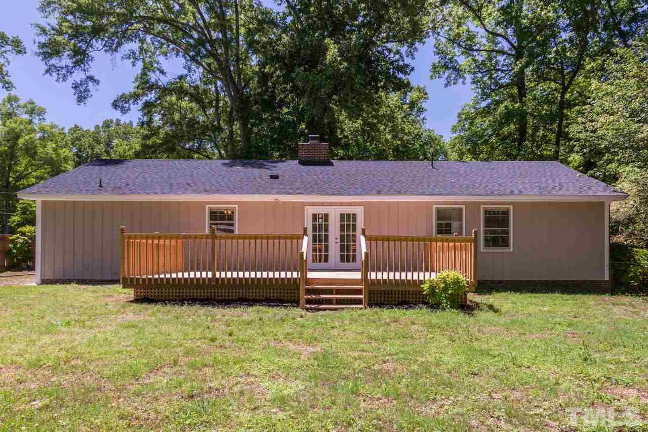5611 Meadowbrook Road Raleigh, NC 27603 - Photo 22 of 25 a view of a house with a yard