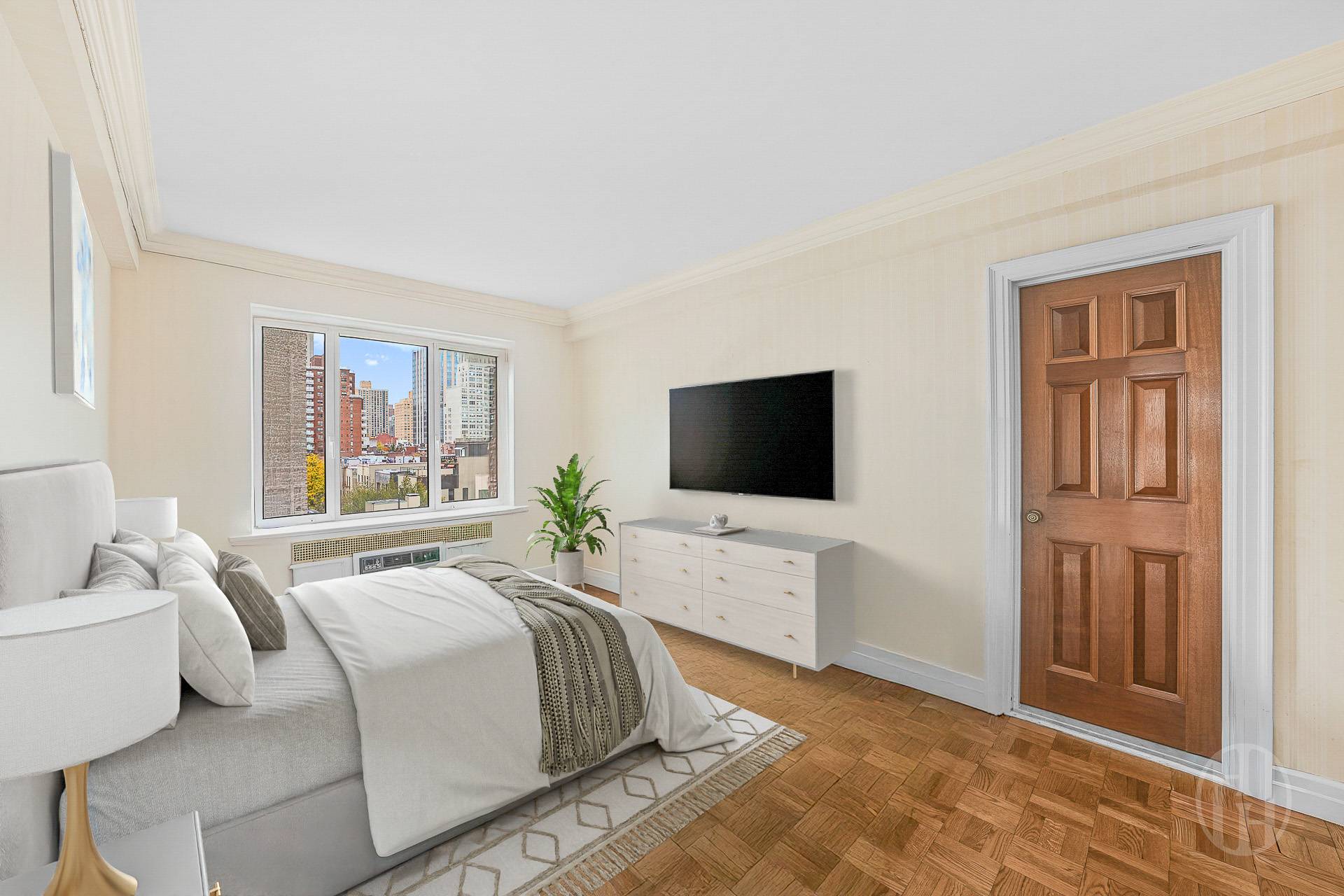 45 East End Avenue, Unit 10F Manhattan, NY 10028 - Photo 13 of 21 a bedroom with a bed and a flat screen tv