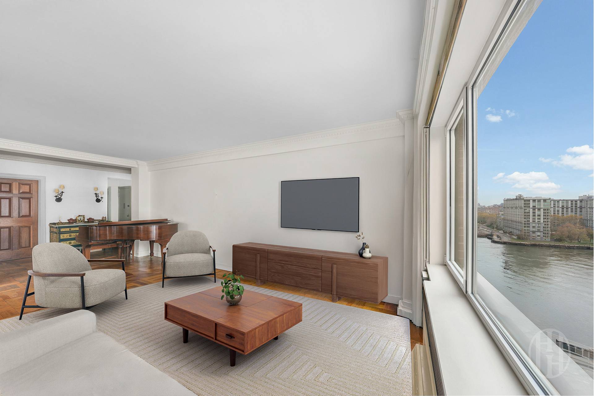 45 East End Avenue, Unit 10F Manhattan, NY 10028 - Photo 2 of 21 a living room with furniture and a flat screen tv