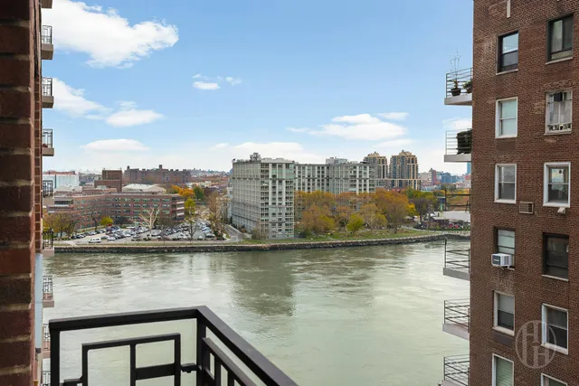 a view of a lake with tall building