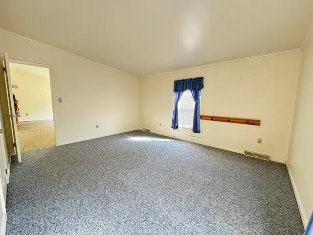 a bathroom with a sink a toilet and a shower