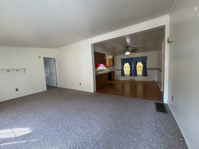a kitchen with stainless steel appliances granite countertop a sink a stove and a wooden floors