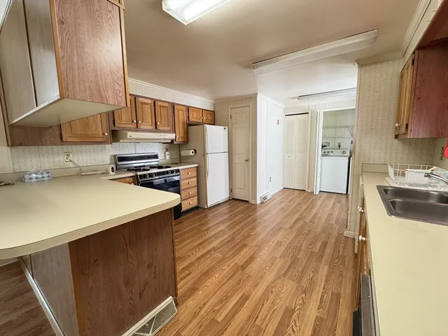 a bedroom with a bed and a large window with outer view
