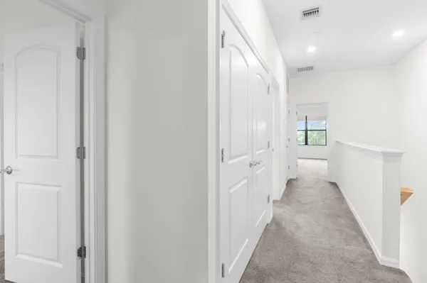 a view of a hallway with toilet