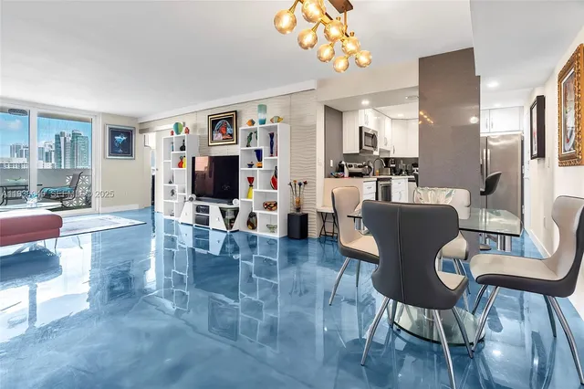 a living room with furniture and a book shelf