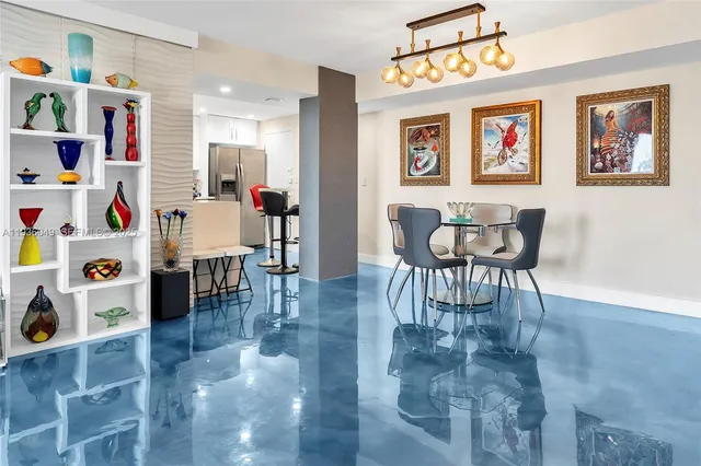 a view of a chairs and table in a balcony