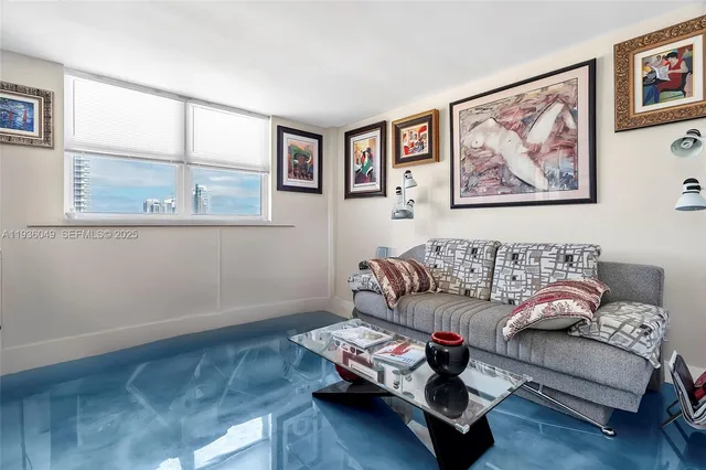 a room with pool table and windows