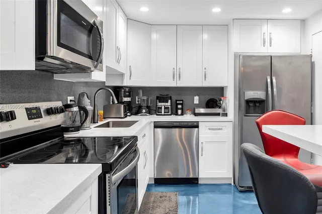 a living room with furniture and a dining table