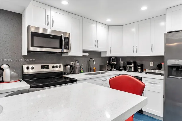 a living room with fireplace furniture and a flat screen tv