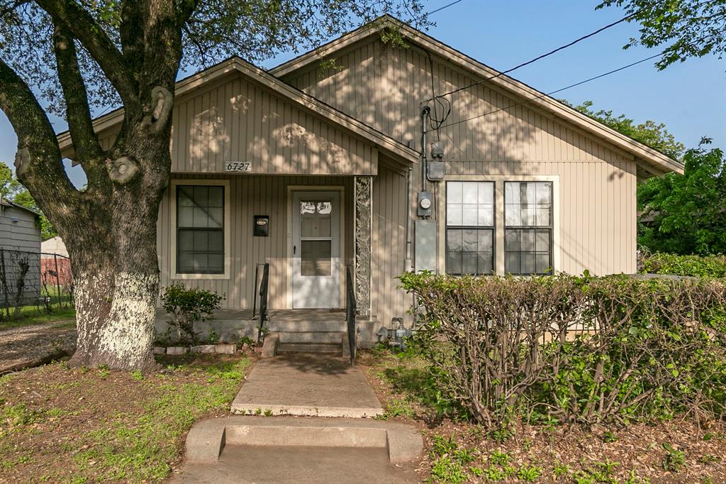 front view of a house with a garden