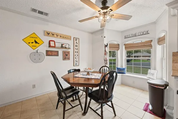 a dining room with furniture and window