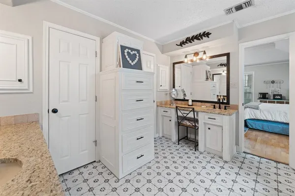 a room with kitchen island a walk in closet and a window