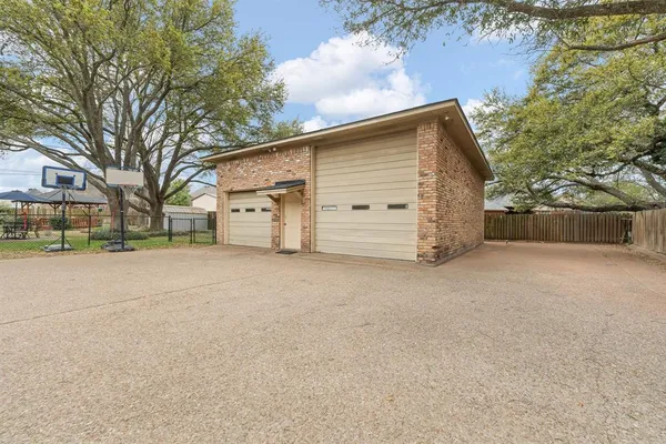 a view of garage yard and tree
