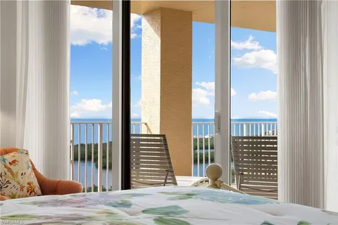 a view of a bedroom with a balcony