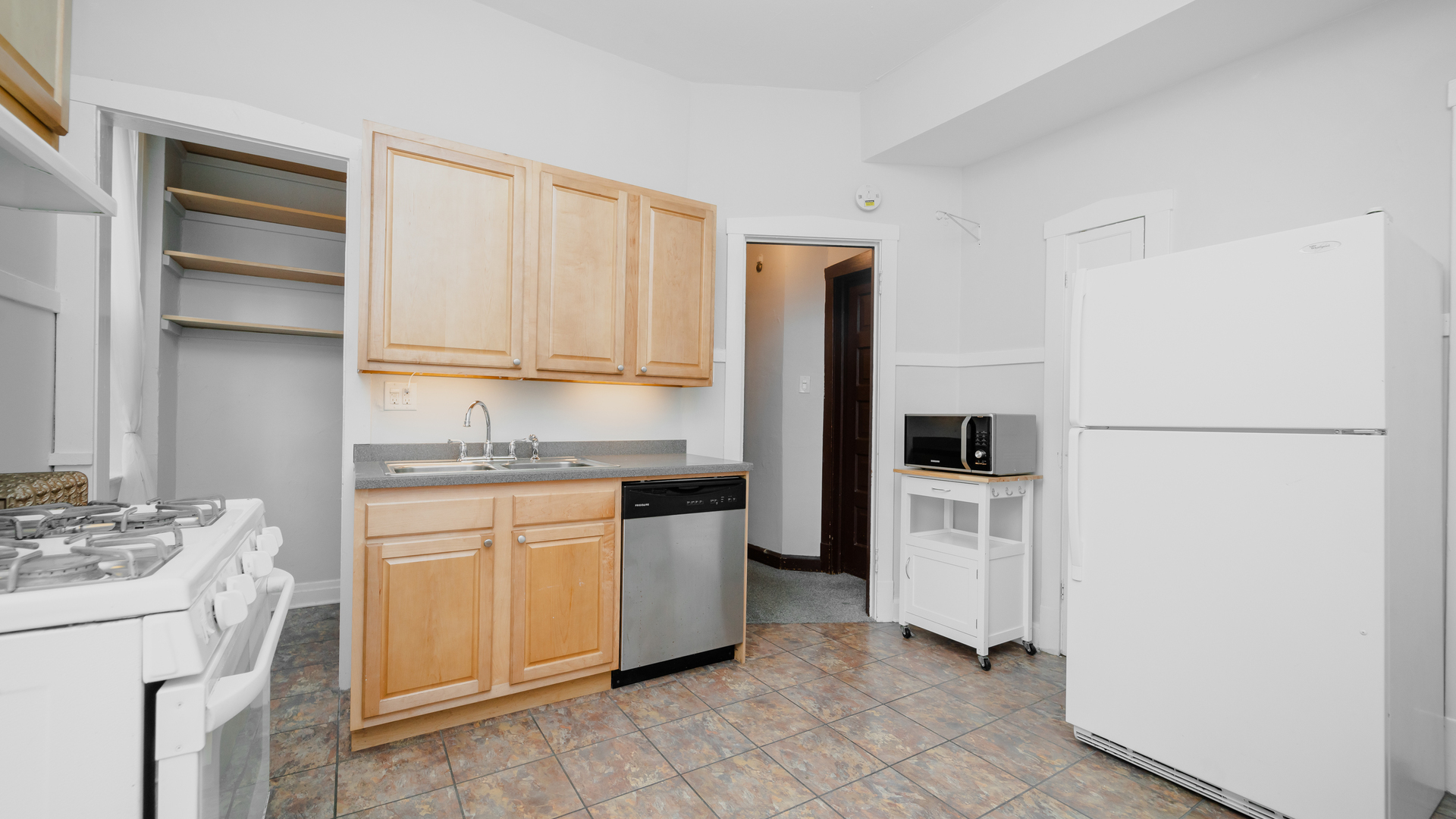 622 West Briar Place, Unit 1 Chicago, IL 60657 - Photo 12 of 20 a kitchen with a refrigerator sink and stove