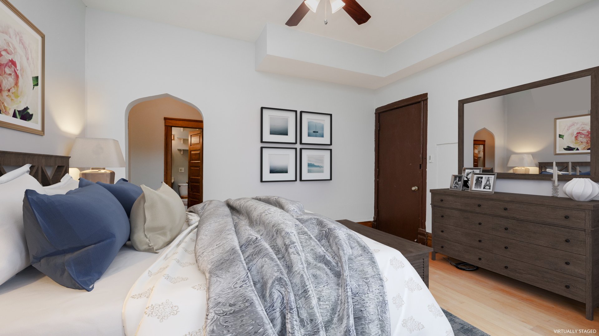 622 West Briar Place, Unit 1 Chicago, IL 60657 - Photo 6 of 20 a bedroom with a bed and a dresser