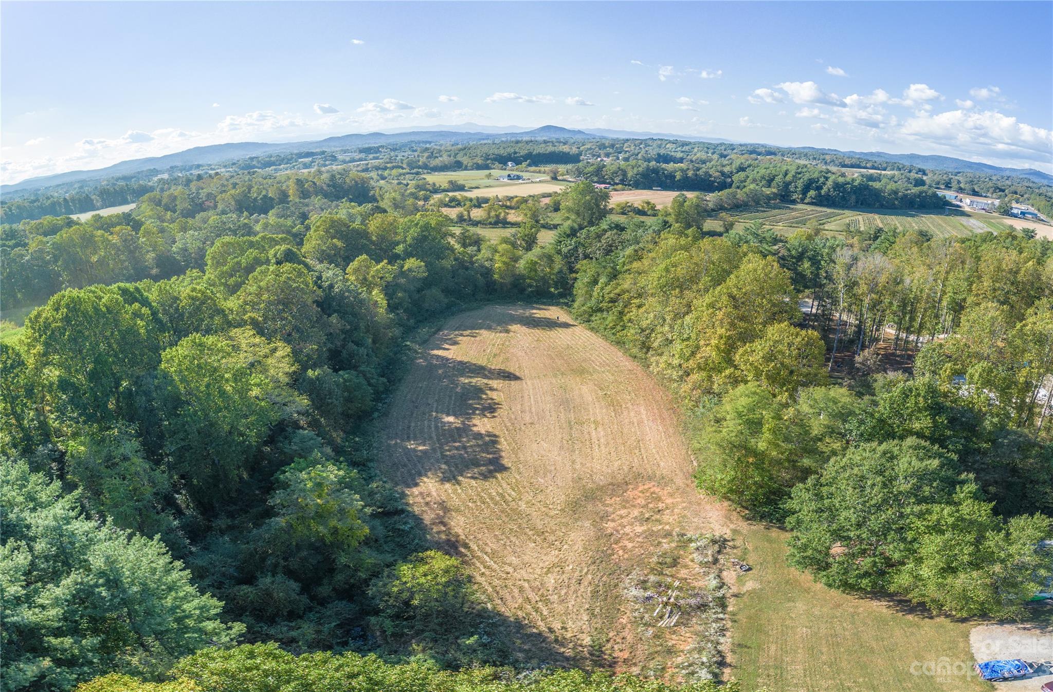 0 Howard Gap Rd Flat Flat Rock, NC 28731 - Photo 11 of 11 a view of a lake with a mountain in the background
