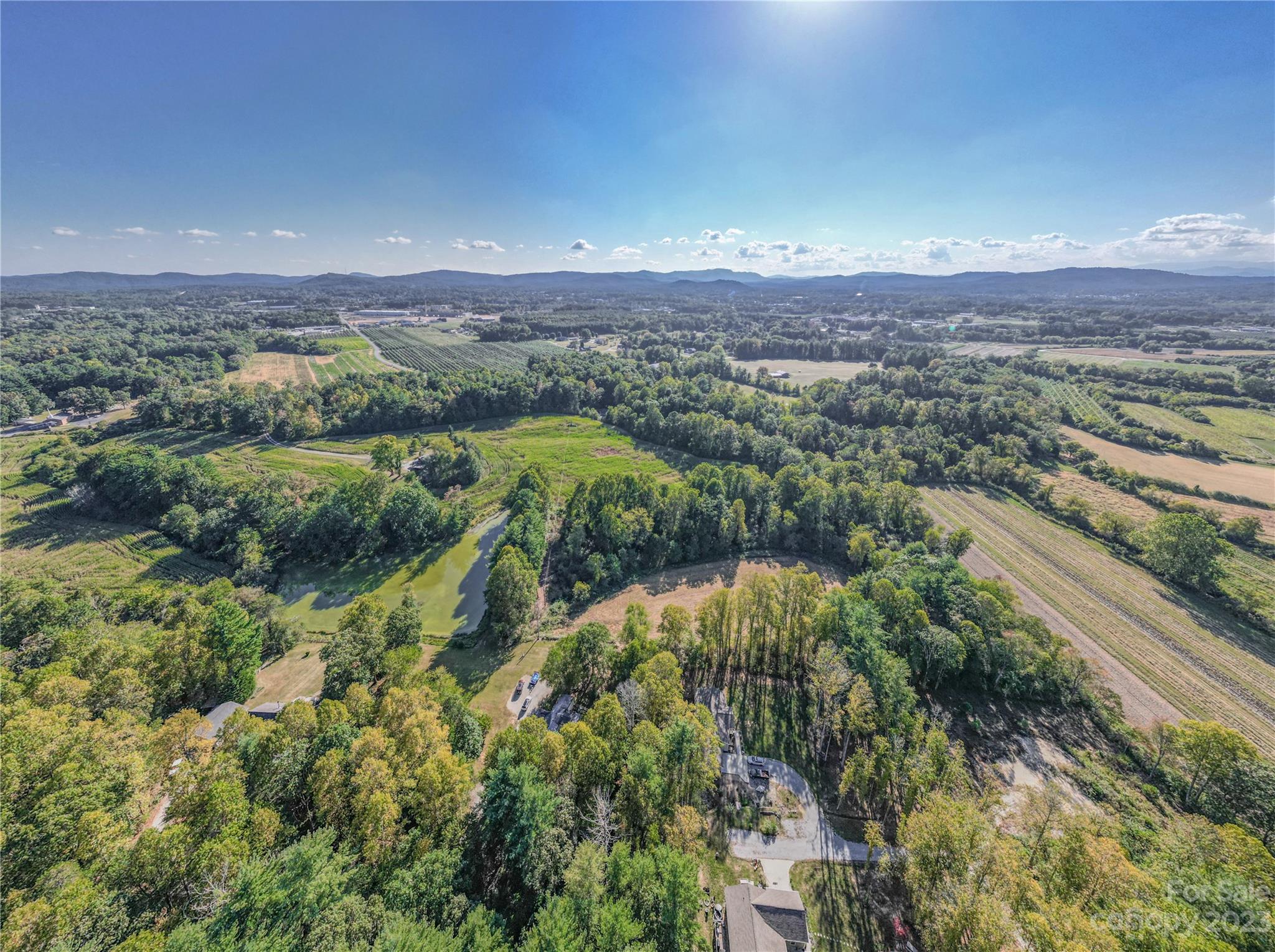 0 Howard Gap Rd Flat Flat Rock, NC 28731 - Photo 7 of 11 a view of a city with mountains in the background