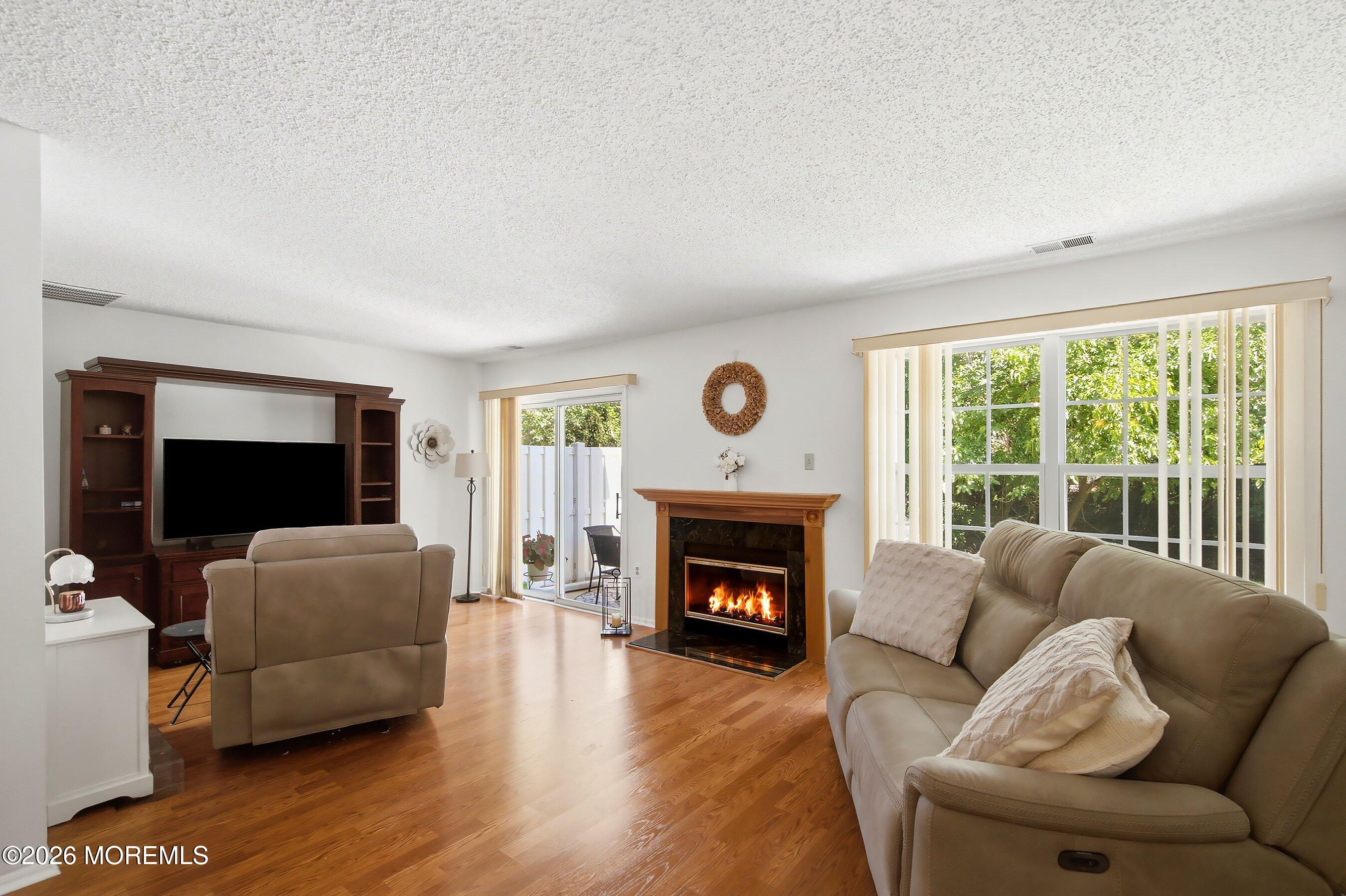 1304 Iris Way, Unit 1304 Brick, NJ 08724 - Photo 3 of 23 03-Living 1a with Fire