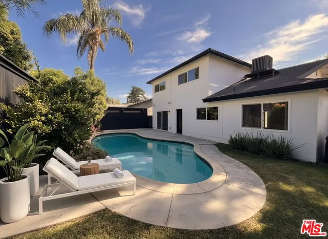 a view of a house with swimming pool