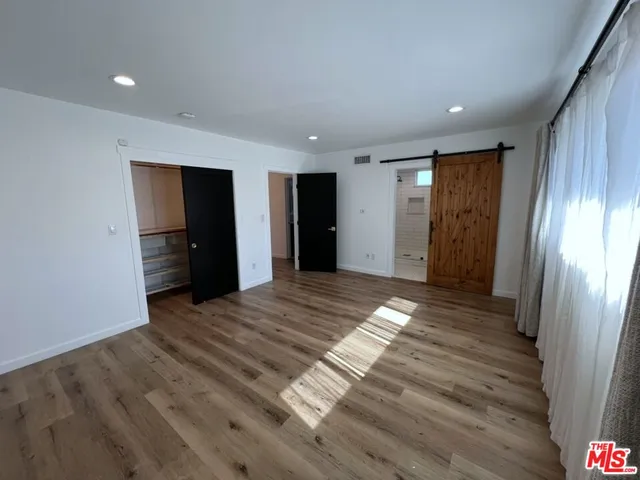 a view of entryway with wooden floor