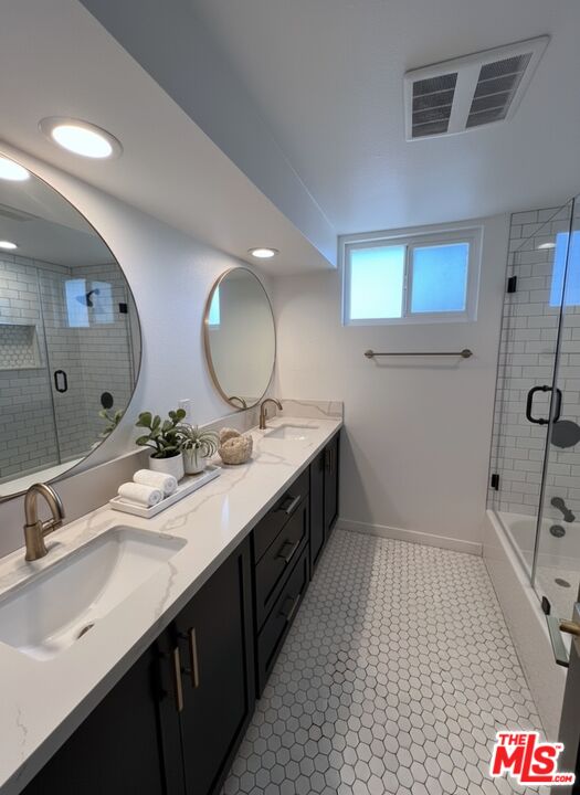 13123 West Magnolia Boulevard Sherman Oaks, CA 91423 - Photo 20 of 26 a spacious bathroom with a sink and a mirror