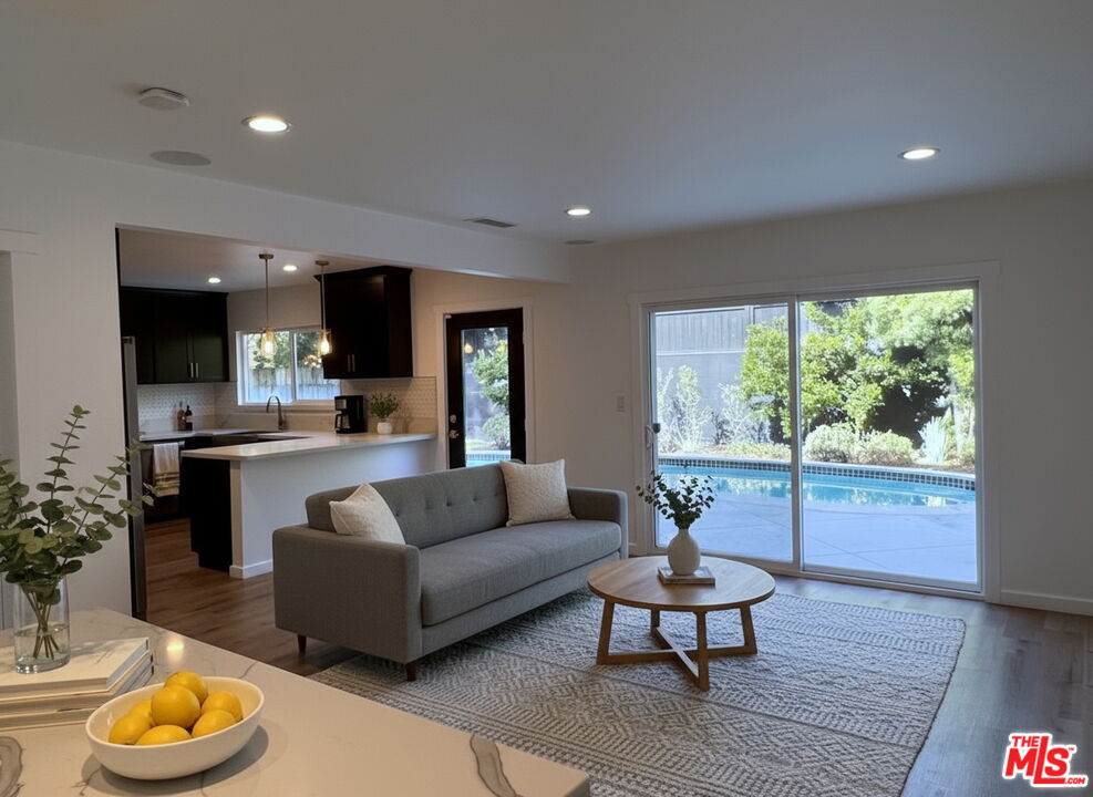 13123 West Magnolia Boulevard Sherman Oaks, CA 91423 - Photo 7 of 26 a living room with furniture and a large window