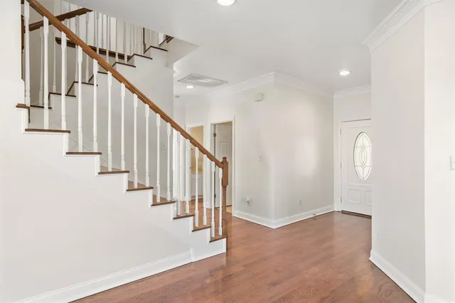 a view of entryway with wooden floor