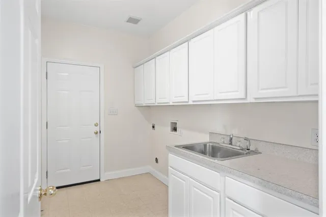 a kitchen with white cabinets