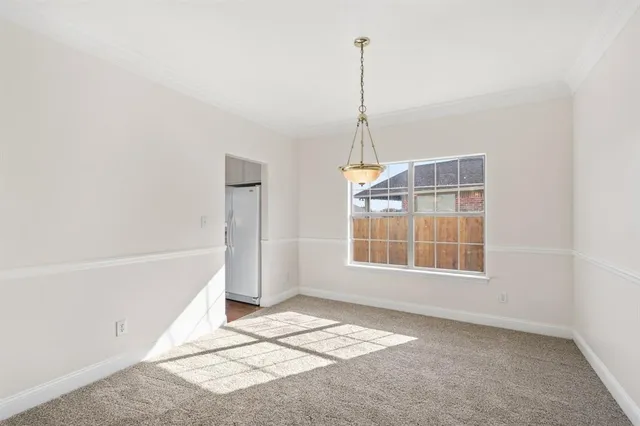 a view of an empty room with windows