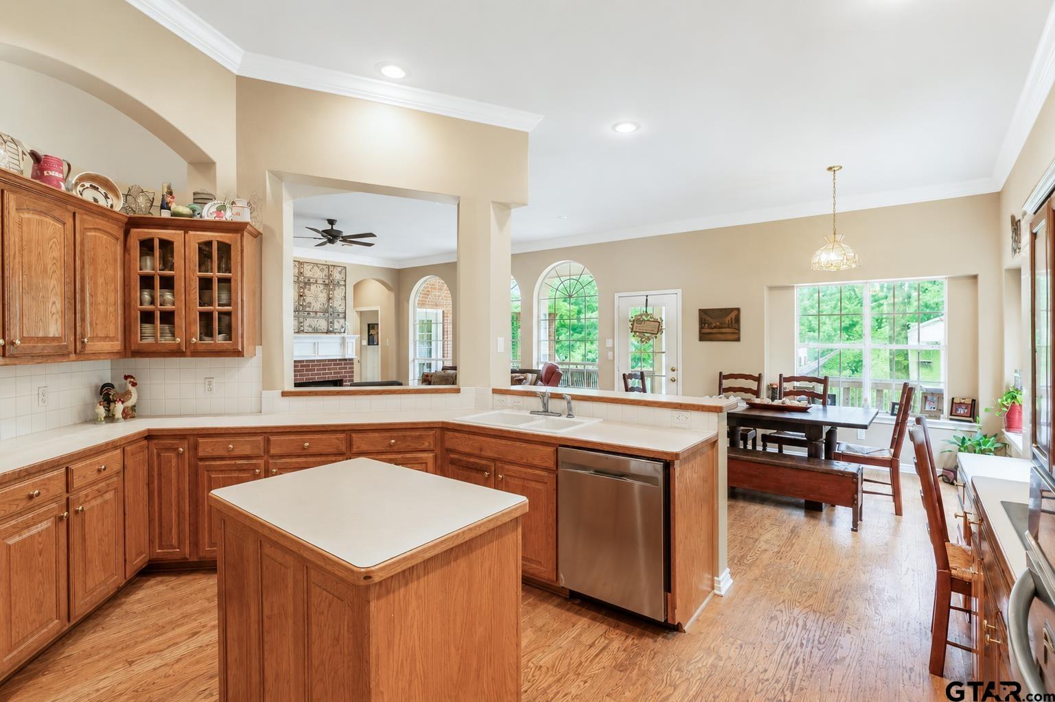 1388 Santa Fe Trail Tyler, TX 75703 - Photo 26 of 46 a kitchen with stainless steel appliances granite countertop a stove and a sink