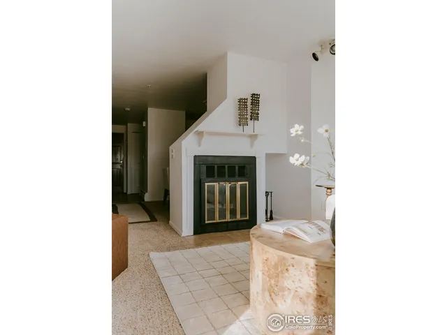 a living room with a couch and a fireplace