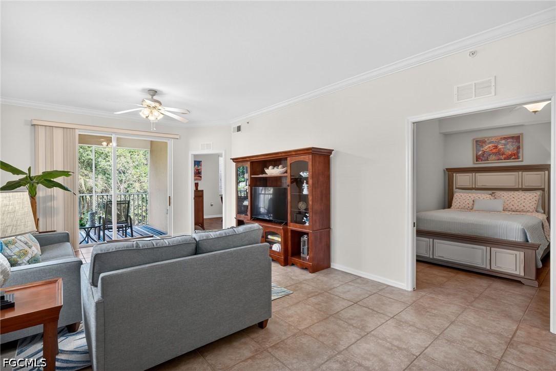 8251 Pathfinder Loop, Unit 621 Fort Myers, FL 33919 - Photo 11 of 30 a living room with furniture and a flat screen tv