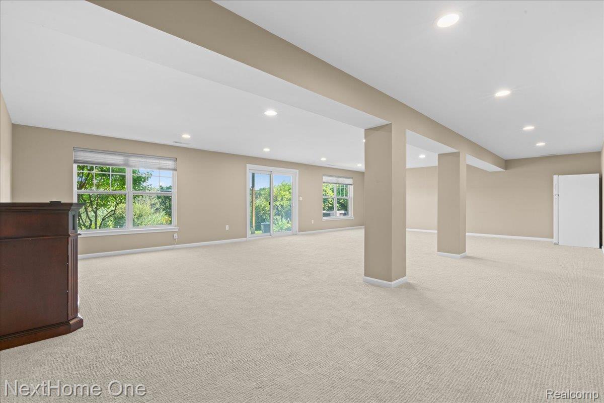 10083 Ridge Run Street, Unit 24 Howell, MI 48855 - Photo 16 of 27 Finished Walkout basement has plenty of natural light