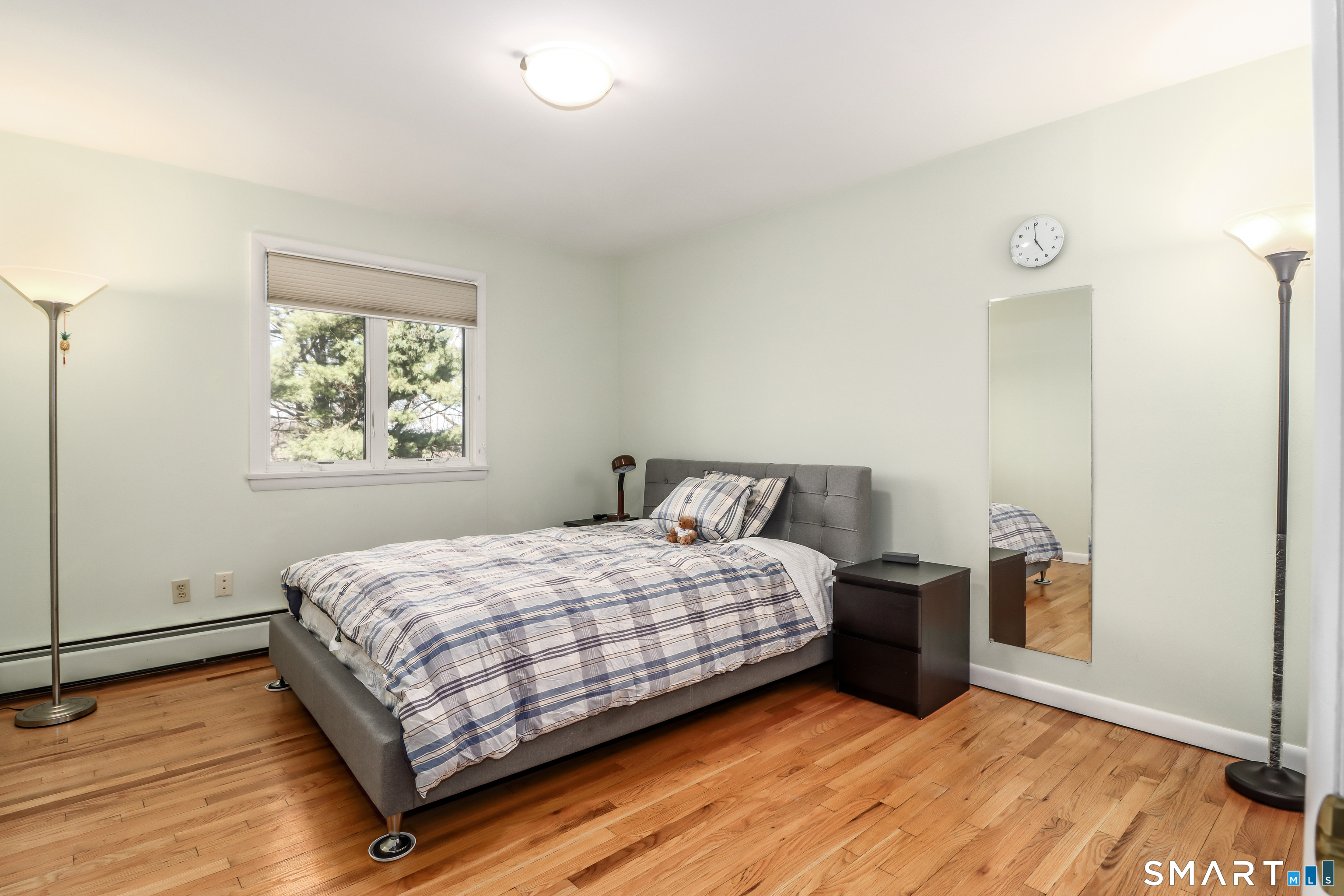 35 East Gate Road Danbury, CT 06811 - Photo 21 of 37 a bedroom with a bed and wooden floor