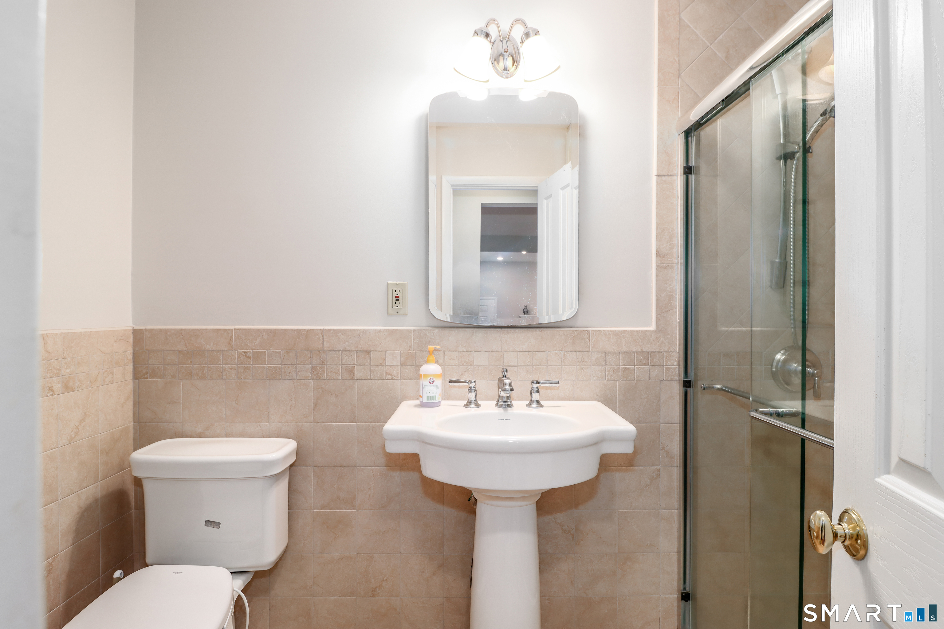 35 East Gate Road Danbury, CT 06811 - Photo 23 of 37 a bathroom with a toilet sink and mirror