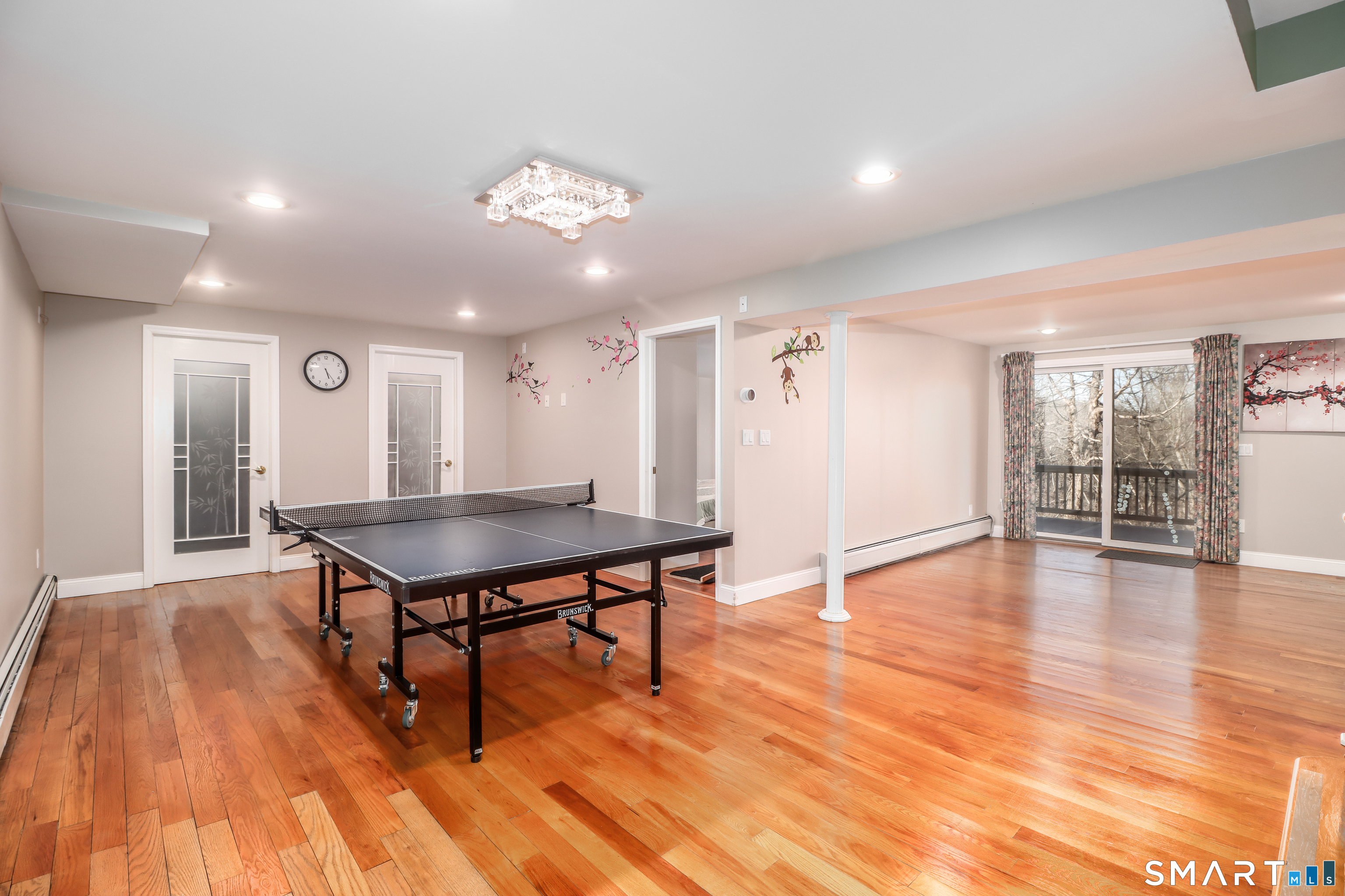 35 East Gate Road Danbury, CT 06811 - Photo 29 of 37 a room with wooden floor table and chairs