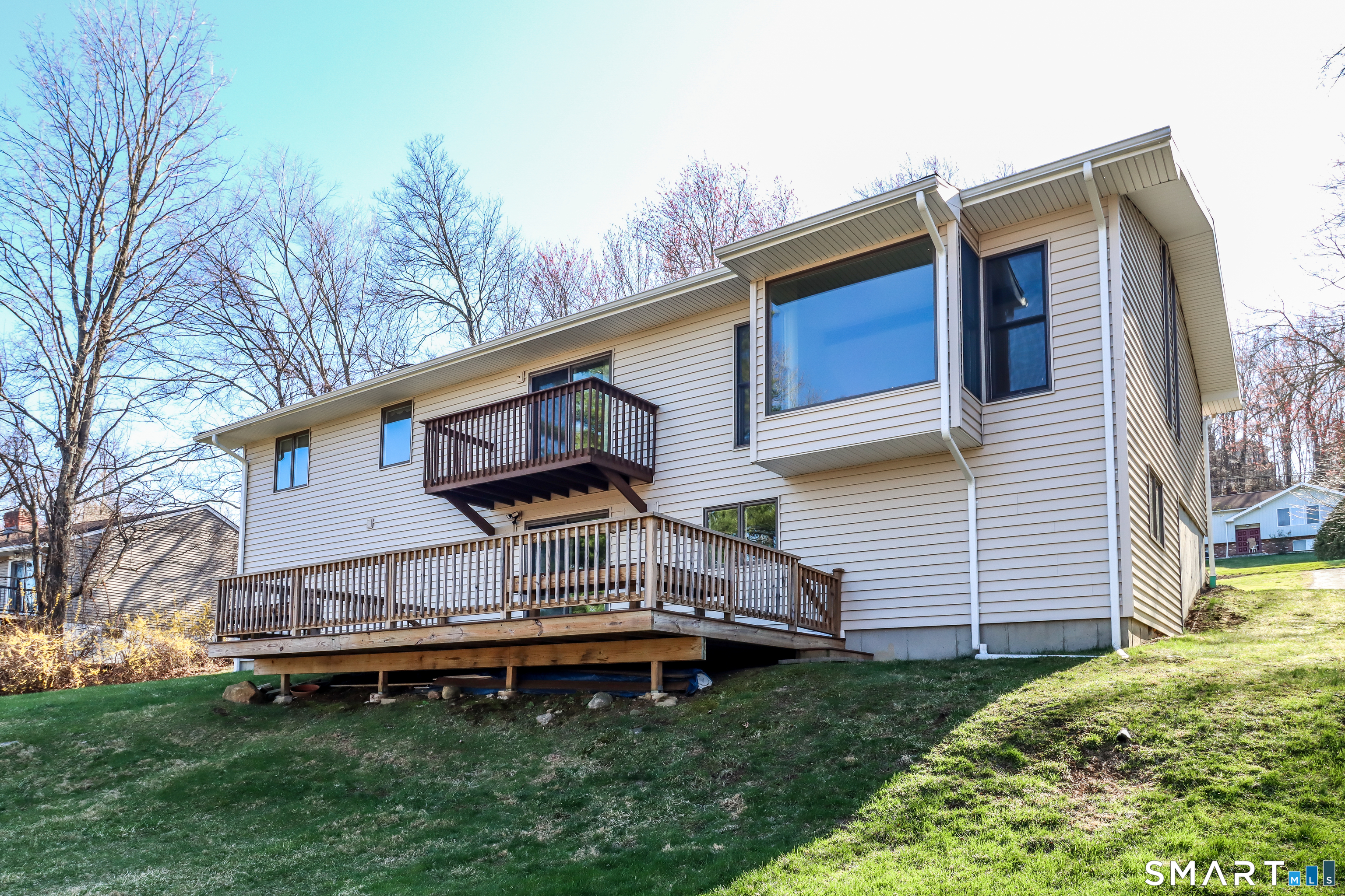 35 East Gate Road Danbury, CT 06811 - Photo 35 of 37 a backyard of a house with a garden and deck