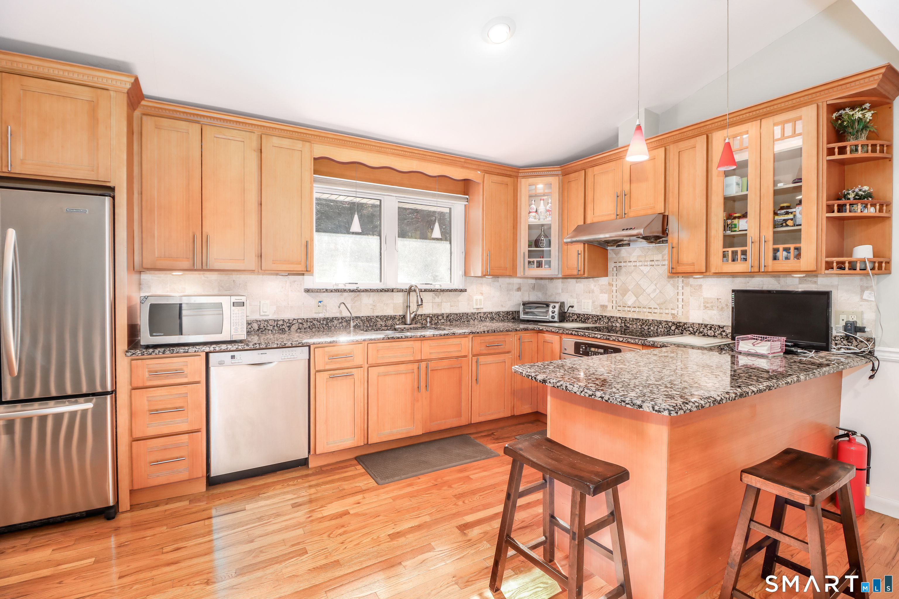 35 East Gate Road Danbury, CT 06811 - Photo 9 of 37 a kitchen with stainless steel appliances granite countertop a stove a sink and a refrigerator
