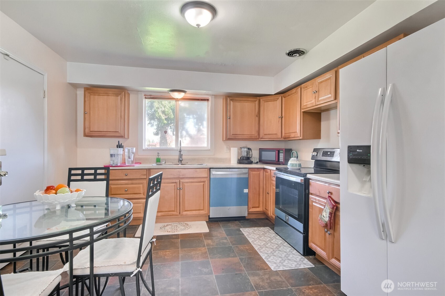 810 Southwest 356th Street Federal Way, WA 98023 - Photo 15 of 40 a kitchen with a sink window and cabinets