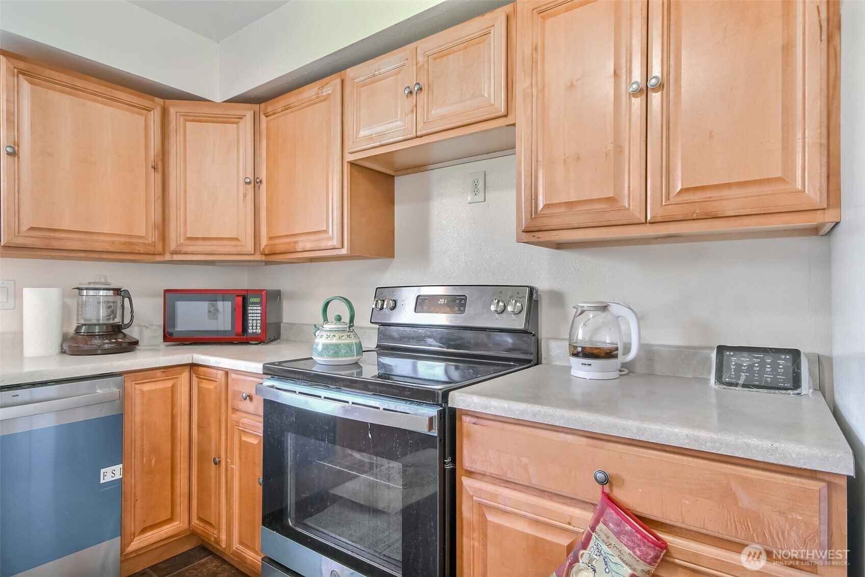 810 Southwest 356th Street Federal Way, WA 98023 - Photo 17 of 40 a kitchen with stainless steel appliances granite countertop a sink and cabinets
