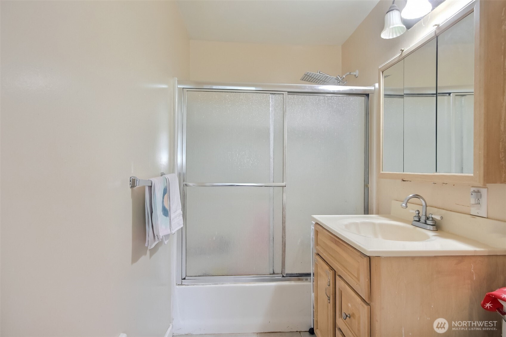 810 Southwest 356th Street Federal Way, WA 98023 - Photo 22 of 40 a bathroom with a sink and a mirror