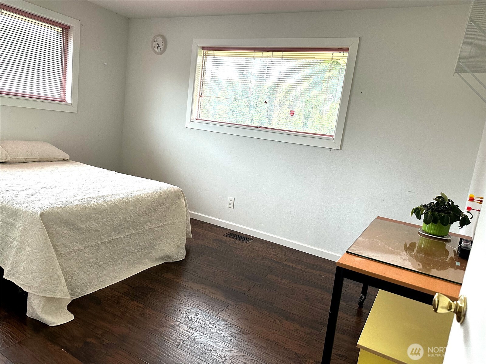 810 Southwest 356th Street Federal Way, WA 98023 - Photo 23 of 40 a bedroom with a bed and wooden floor