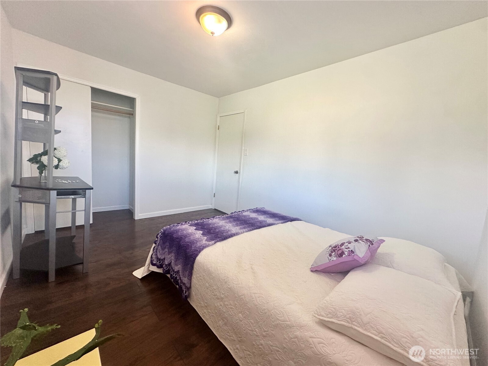 810 Southwest 356th Street Federal Way, WA 98023 - Photo 26 of 40 a bedroom with a bed and wooden floor