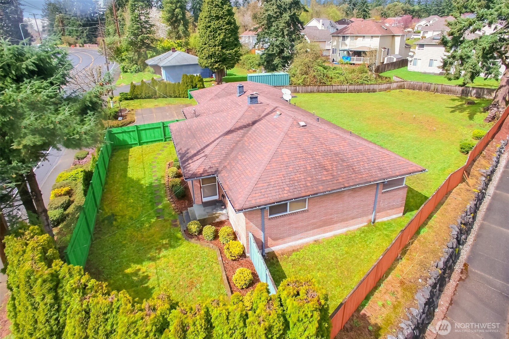 810 Southwest 356th Street Federal Way, WA 98023 - Photo 33 of 40 an aerial view of a house with a garden and swimming pool