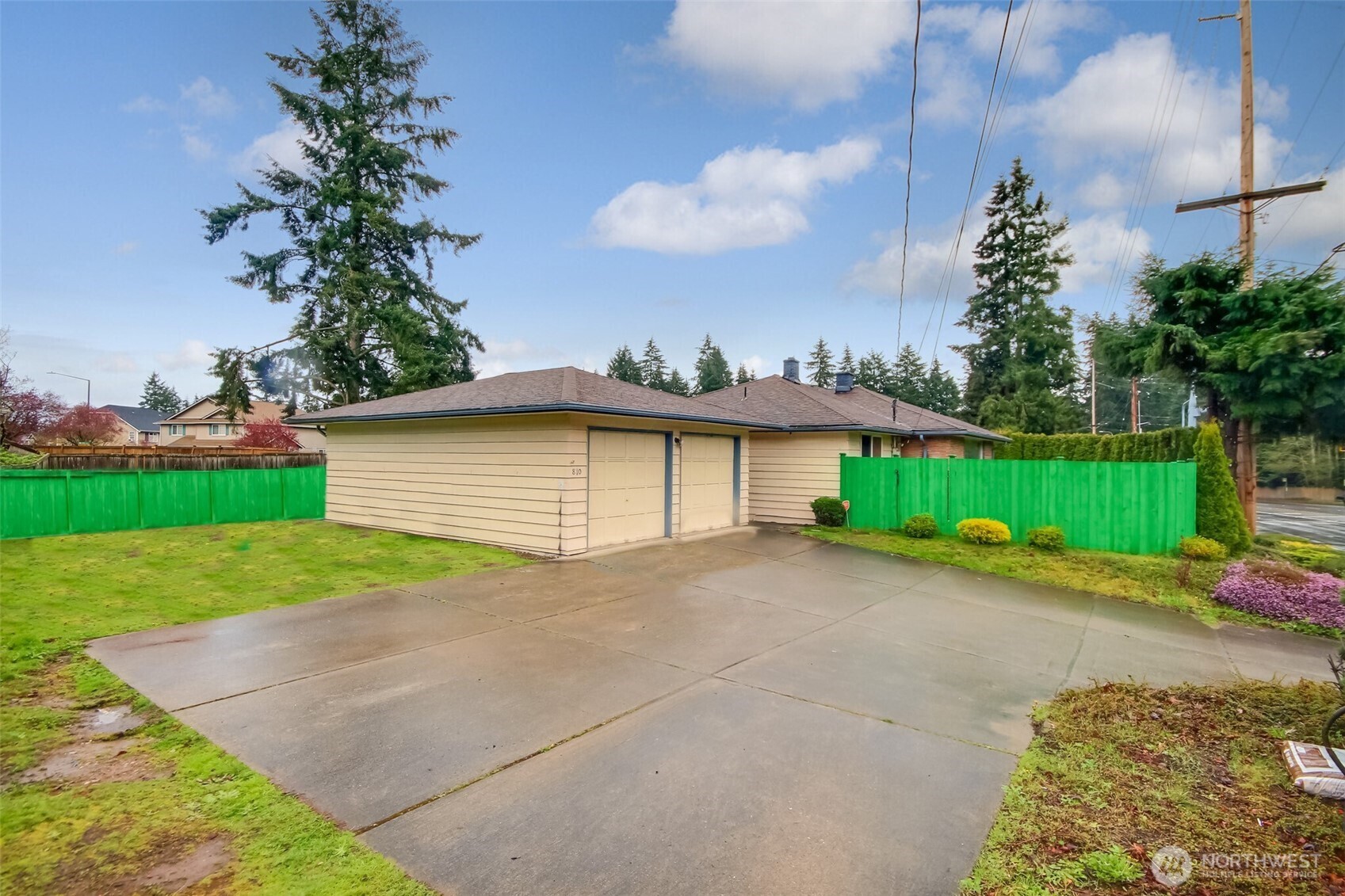 810 Southwest 356th Street Federal Way, WA 98023 - Photo 38 of 40 a front view of a house with a yard and garage