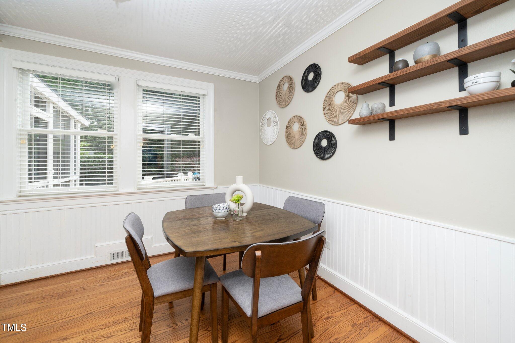 406 Brooks Avenue Raleigh, NC 27607 - Photo 15 of 33 a view of a dining room with furniture and window