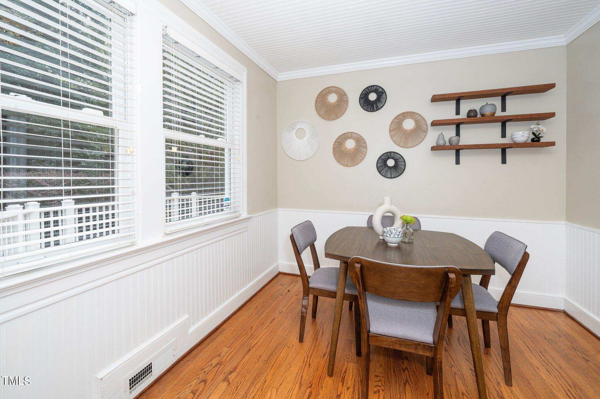 406 Brooks Avenue Raleigh, NC 27607 - Photo 16 of 33 a view of a dining room with furniture and wooden floor