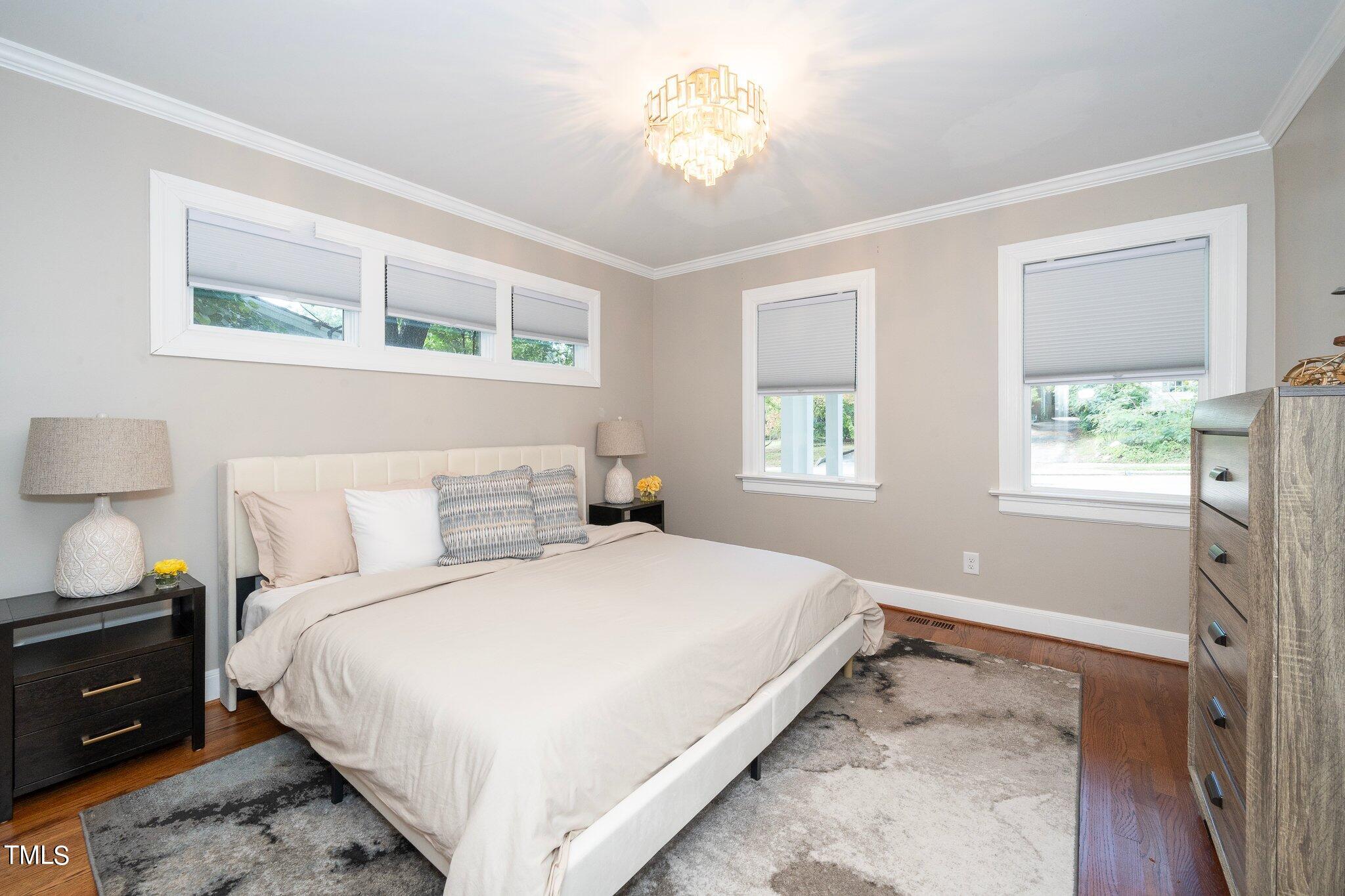 406 Brooks Avenue Raleigh, NC 27607 - Photo 19 of 33 a bedroom with a bed and a window